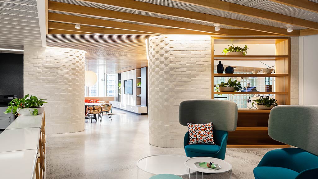 A room with a large ceiling and chairs.