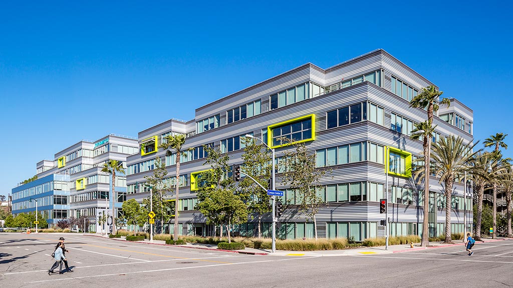 A large building with trees in front of it.