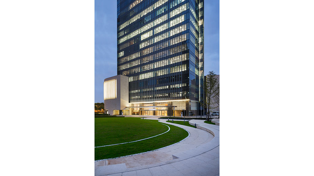 A building with a lawn in front of it.