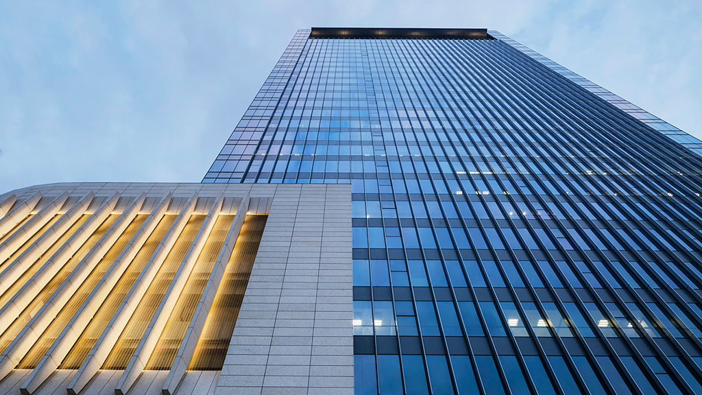 A tall building with glass windows.
