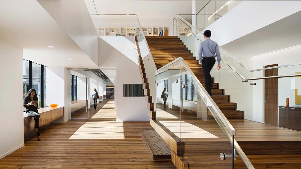 People walking up a staircase.