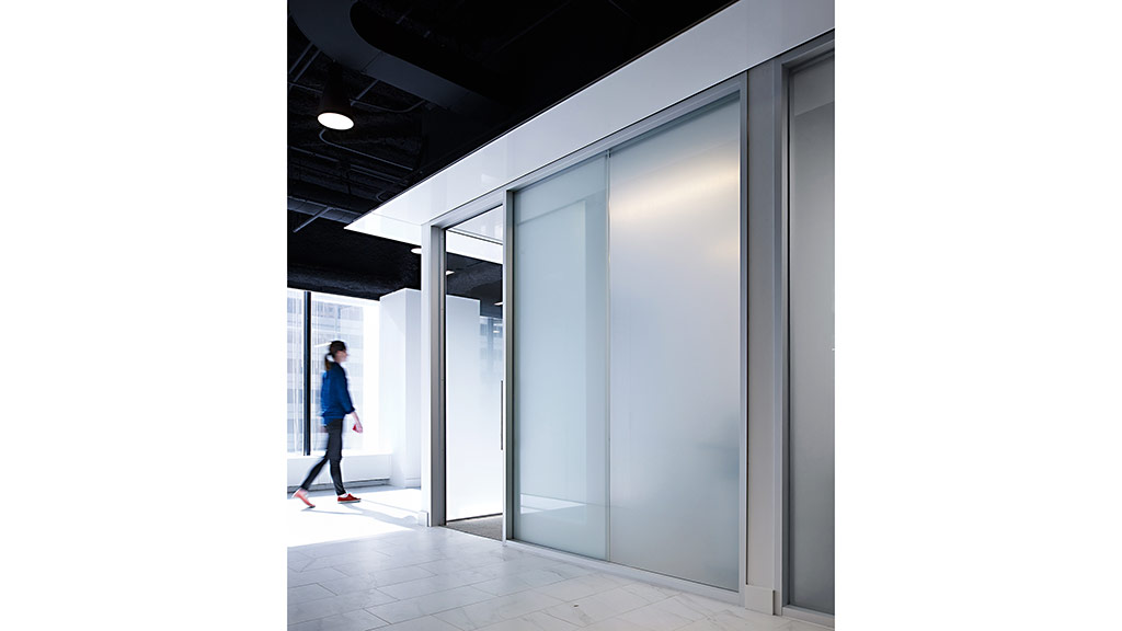 A person walking in a hallway.