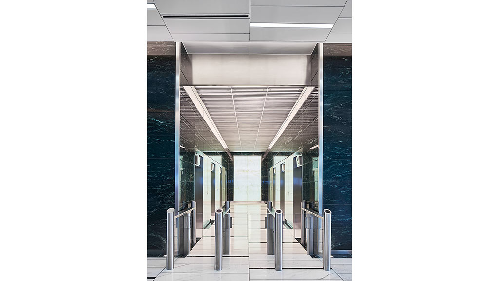 A hallway with glass walls.