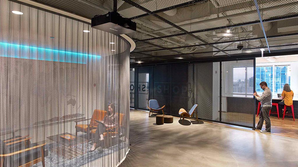 A couple of people in a warehouse.