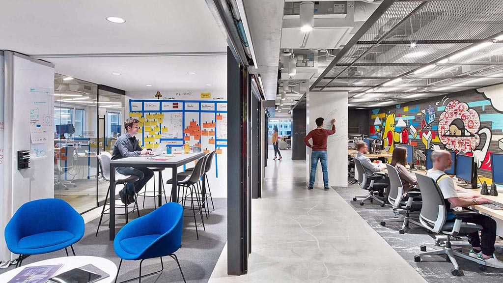 A group of people sitting at tables.