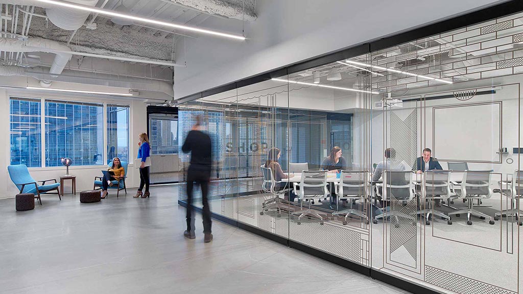 A group of people in a room.