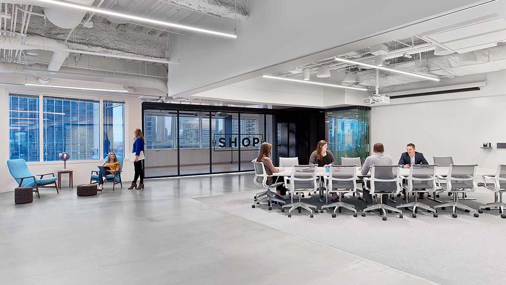 A group of people sitting at tables.