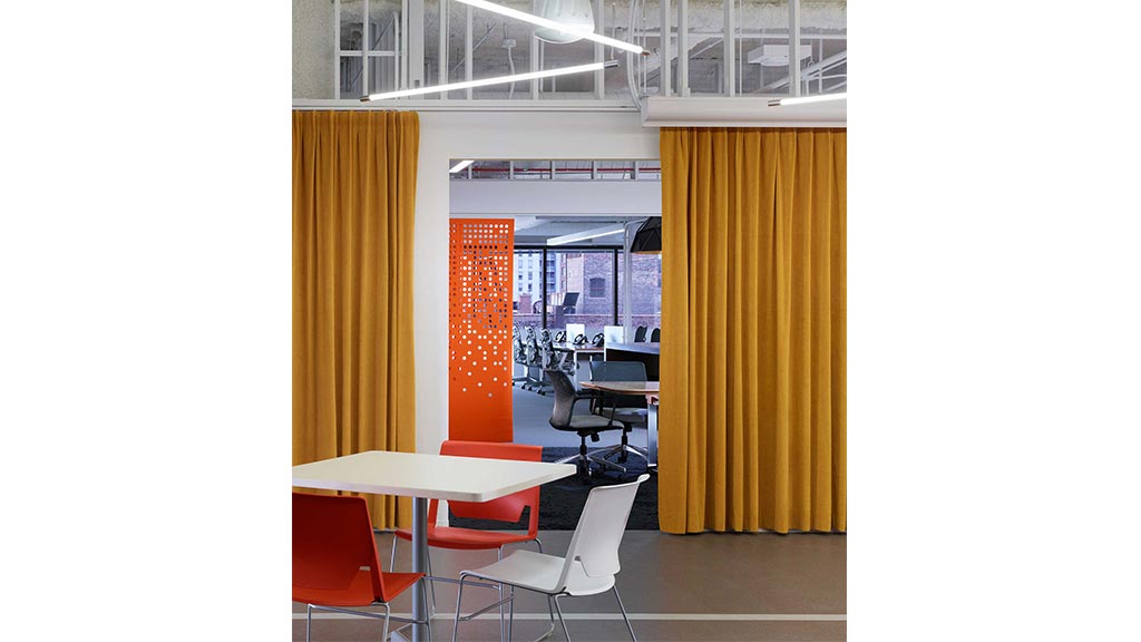 A room with tables and chairs.
