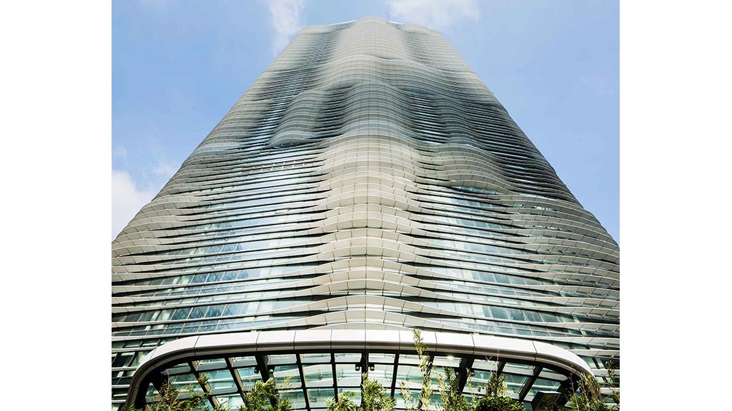 A tall building with glass walls.