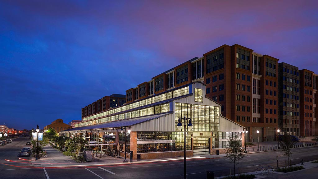 A large building with a parking lot.