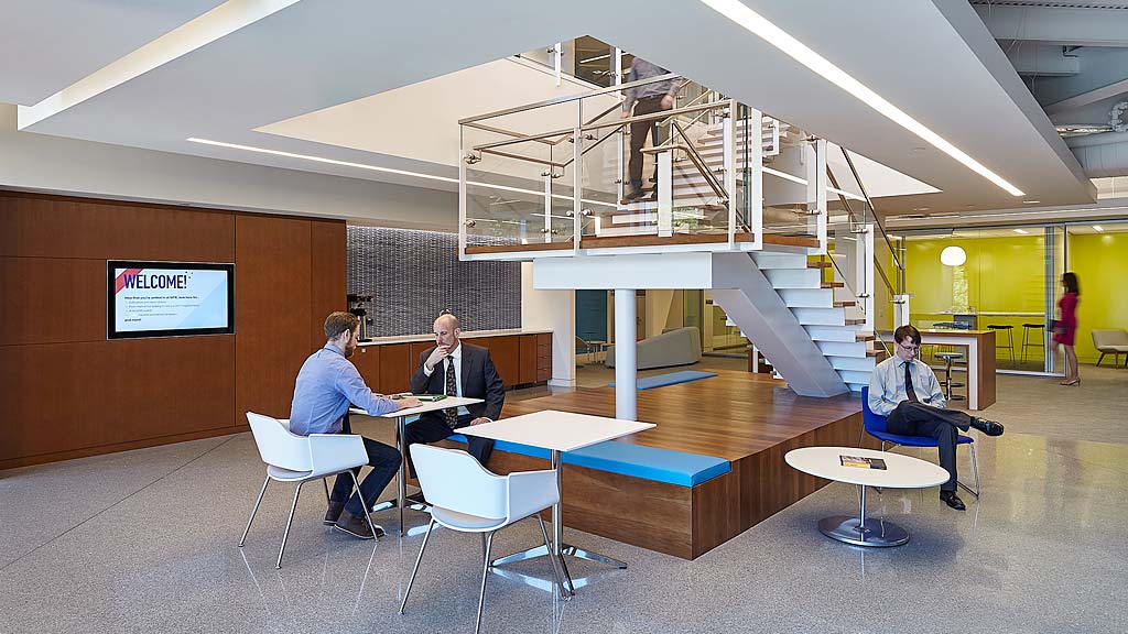 A group of people sitting at tables.