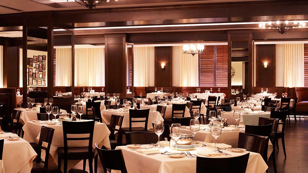 A room with tables and chairs.