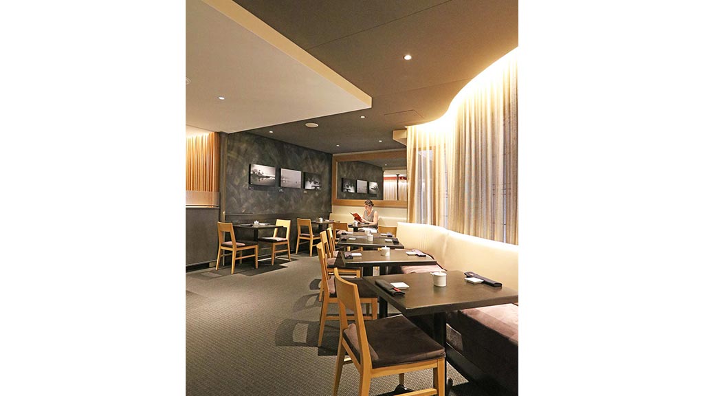 A room with tables and chairs.