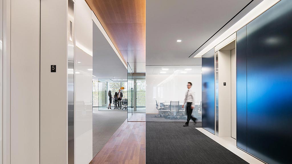 A person walking in a hallway.