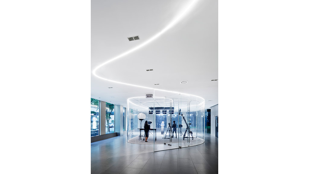 A group of people walking through a building.