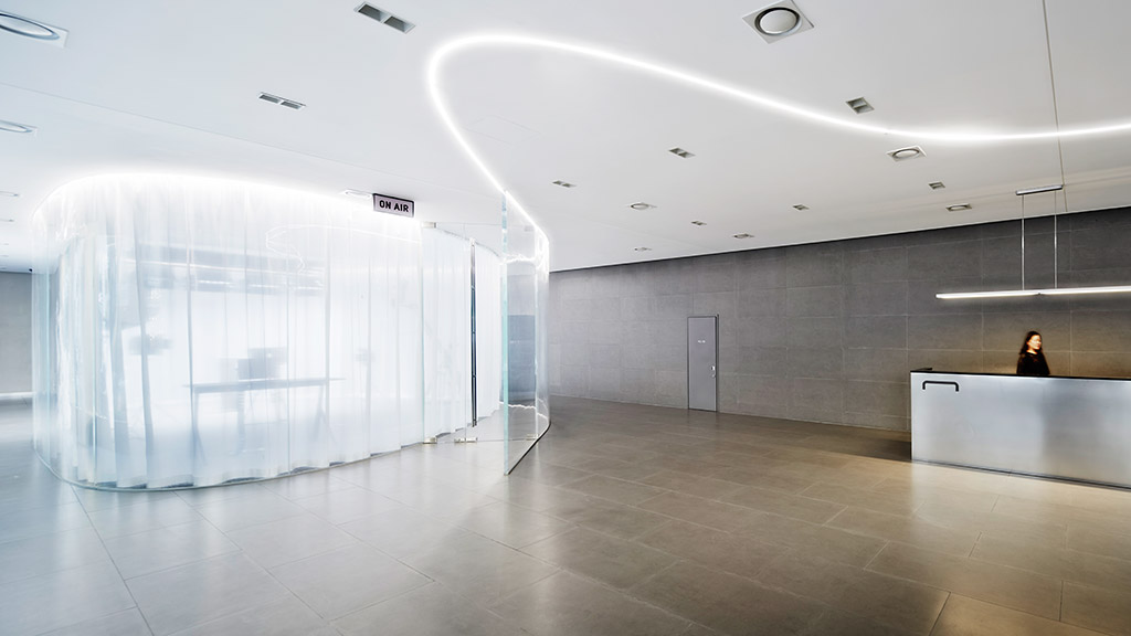 A person standing in a large room.