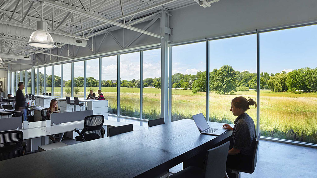 A group of people sitting at tables.