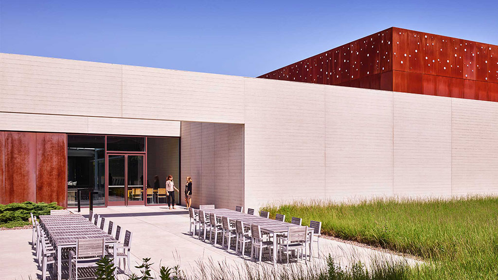 A building with chairs outside.