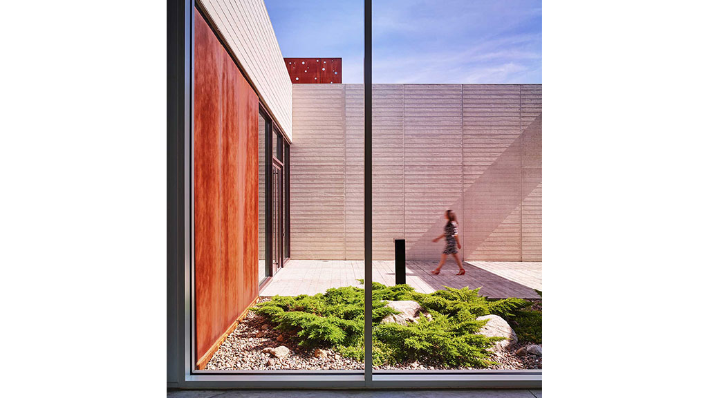 A person walking on a sidewalk.