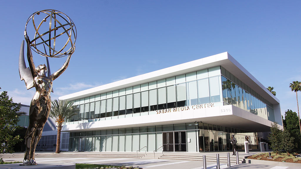 A building with a statue in front of it.