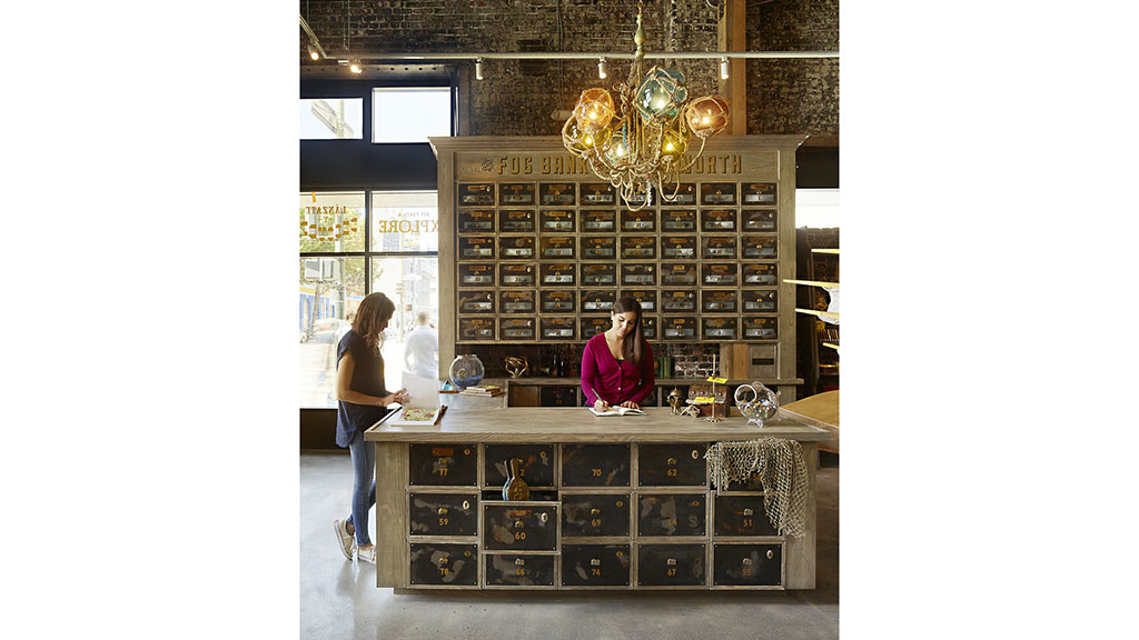 A person standing at a counter.