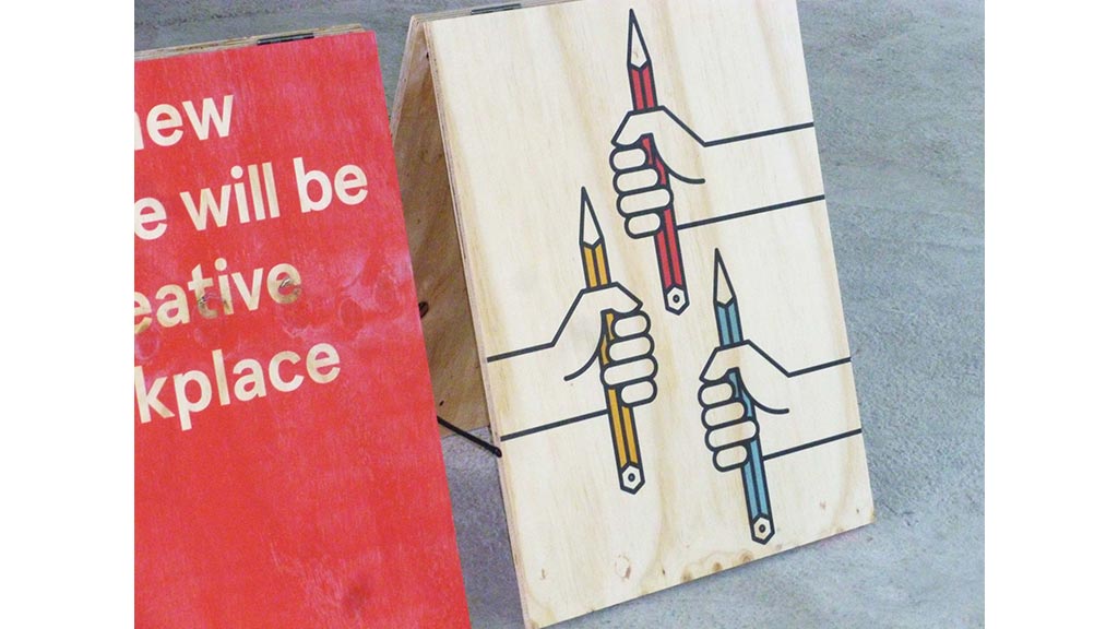 A sign next to a drawing.