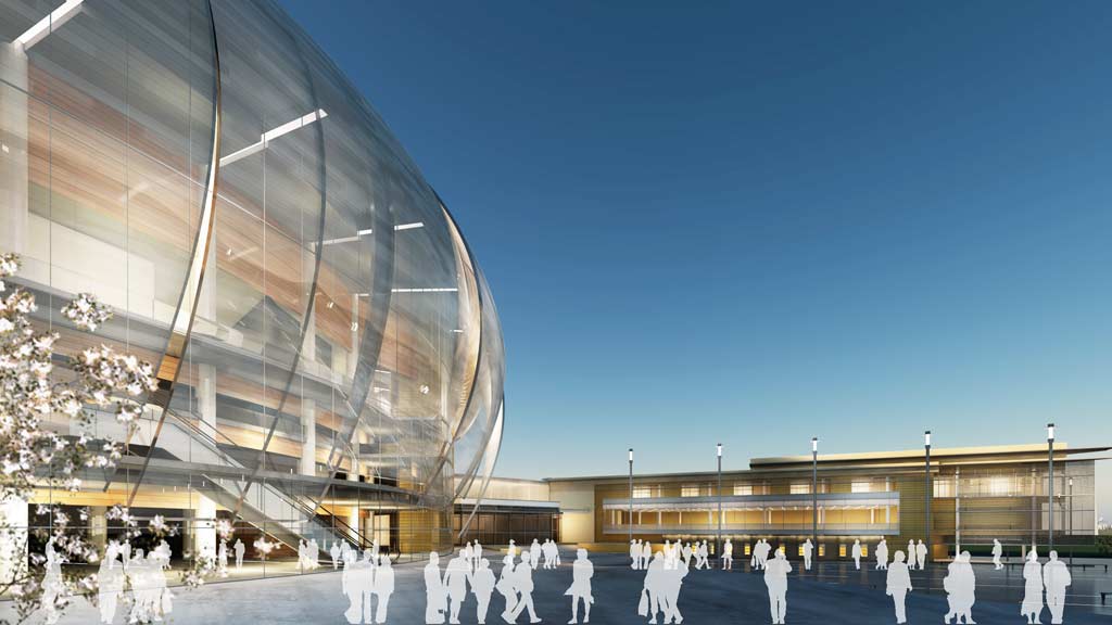 A group of people in white robes outside a building.