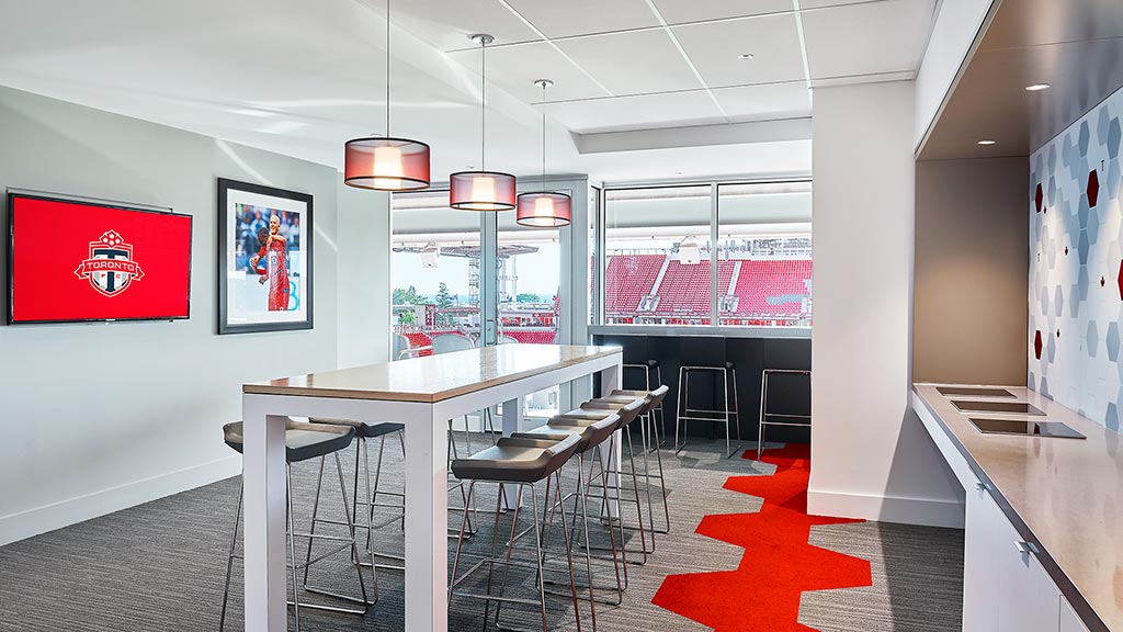 A room with a table and chairs.