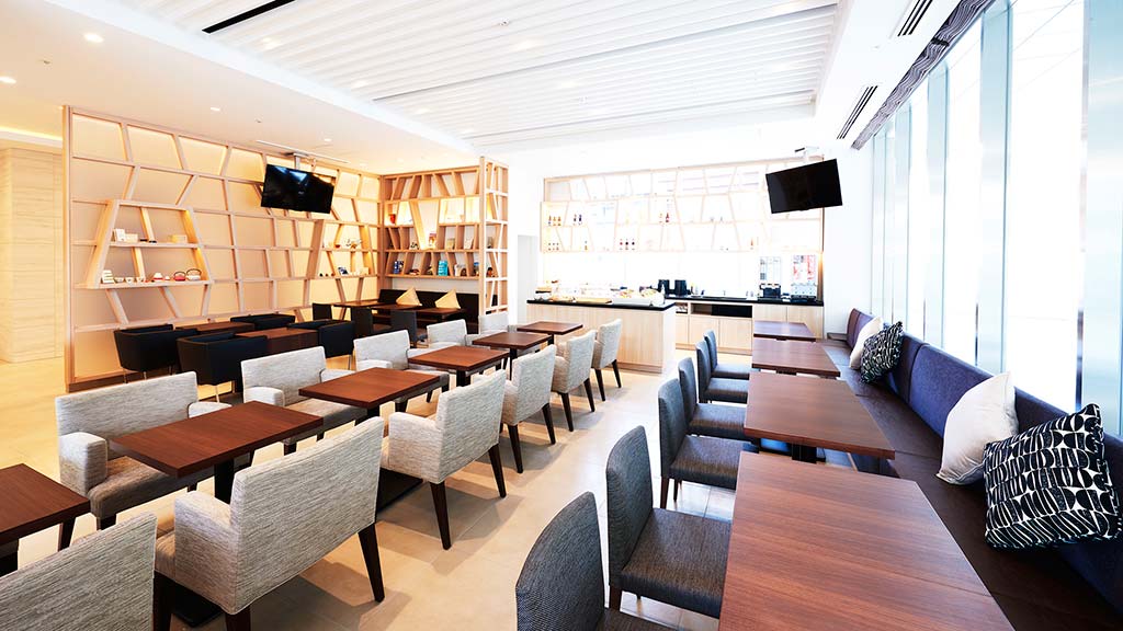 A room with tables and chairs.