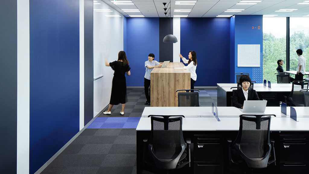 A group of people in an office.