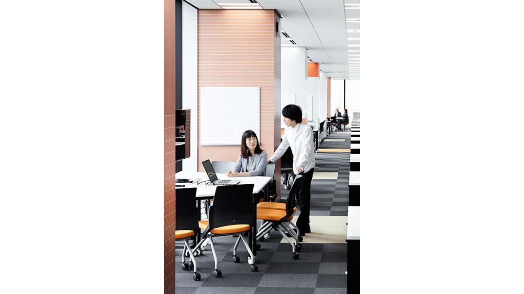 A woman and a man in an office.