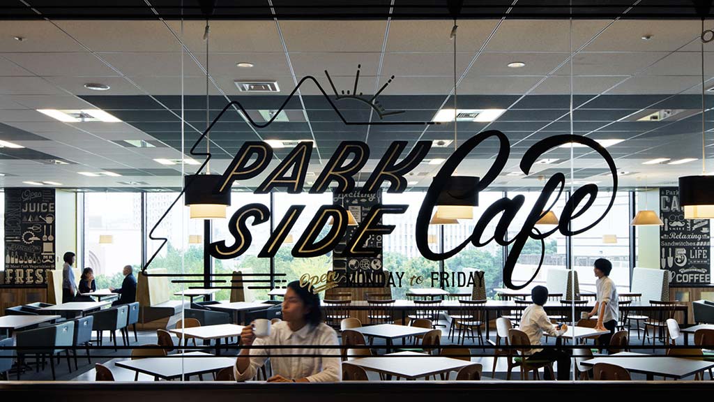 A group of people sitting at tables.