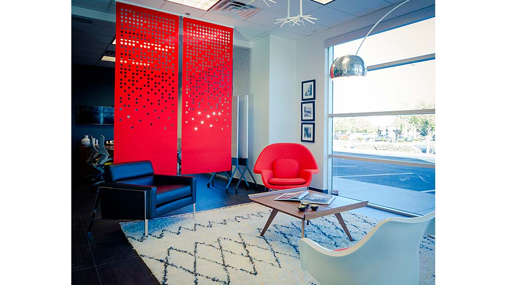 A living room with a red curtain.