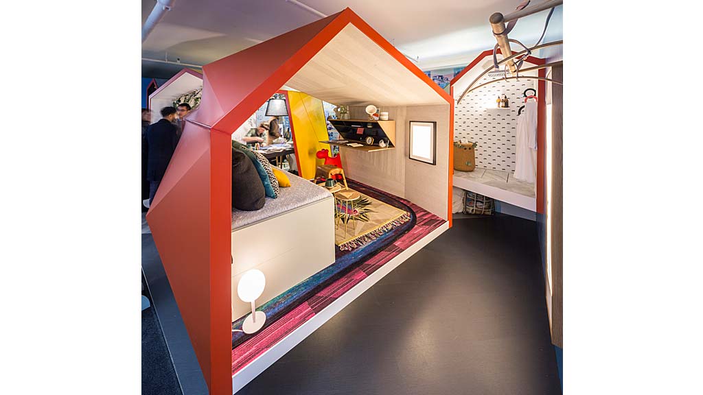 A room with a bed and a mirror.