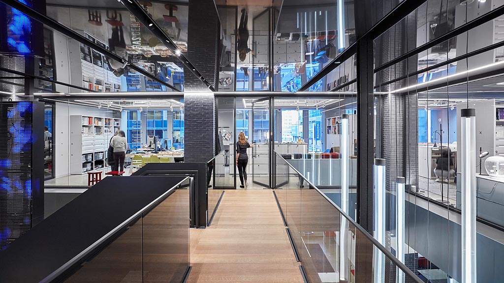 A long hallway with glass walls.
