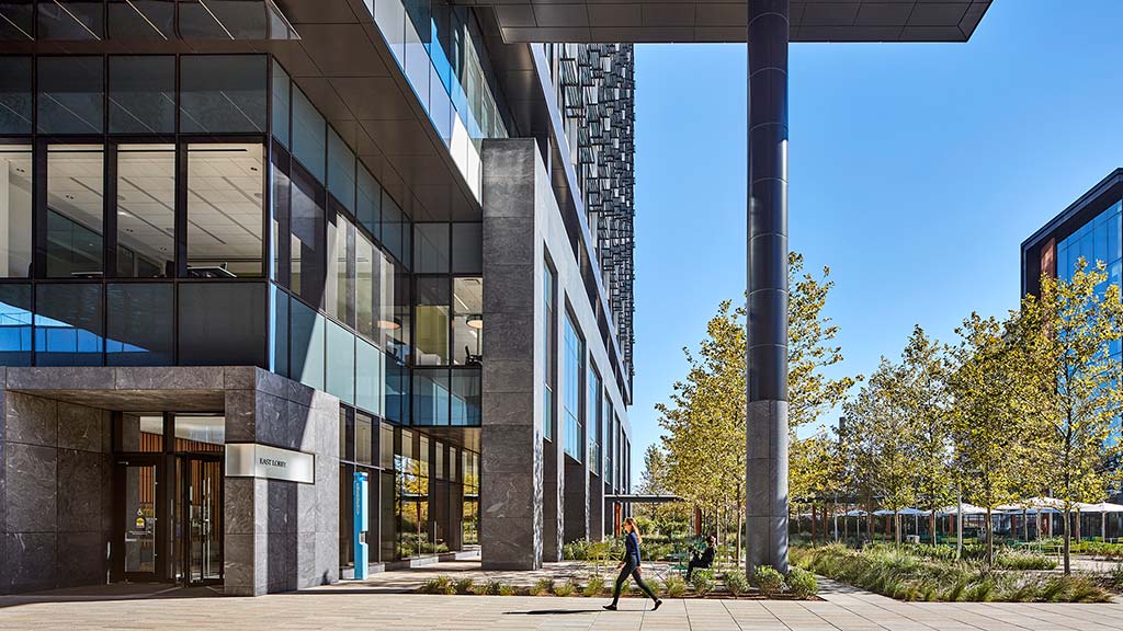 A building with a pole in front.