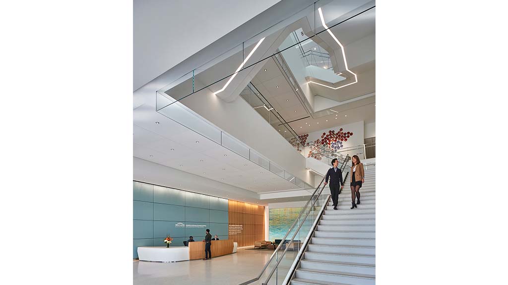 People walking up a staircase.