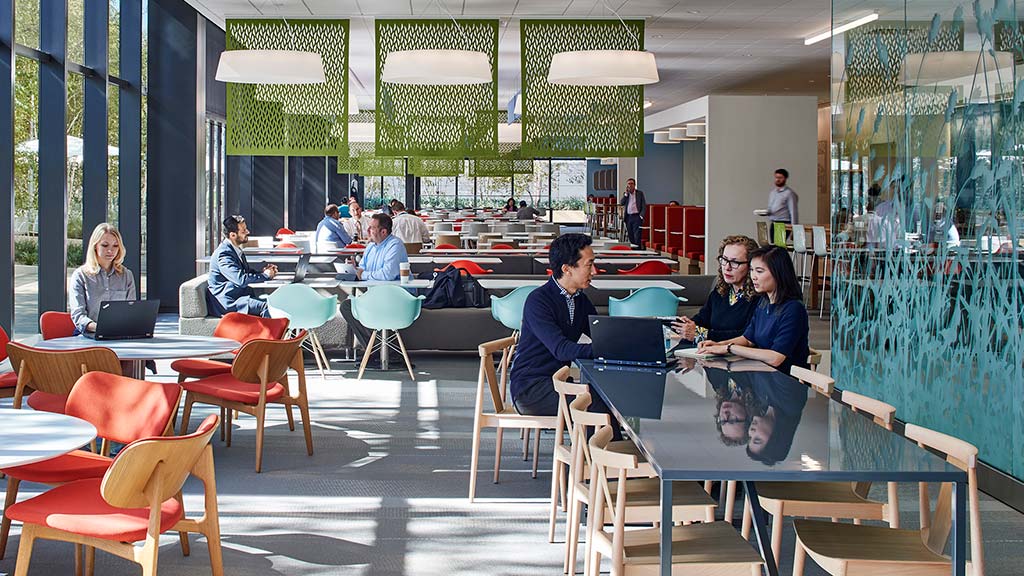 A group of people sitting at tables.