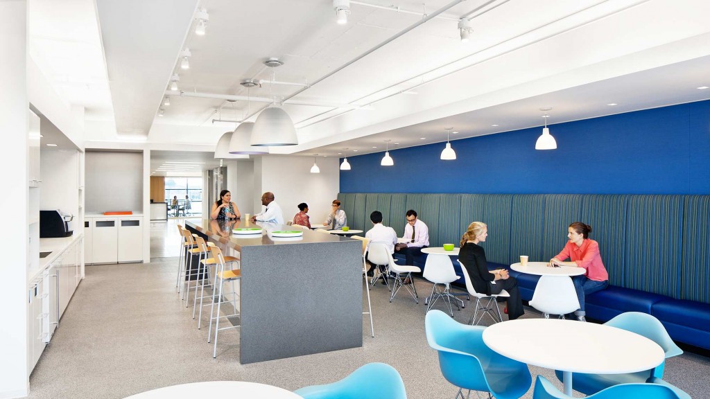 A group of people sitting at tables.