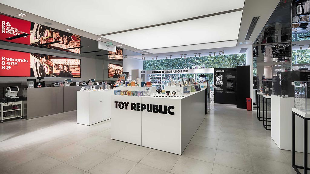 A large room with signs and a large display of products.