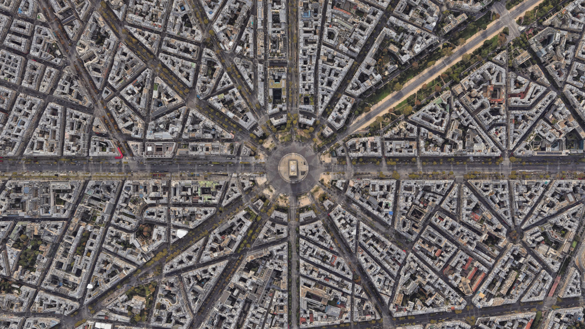 A satellite view of Parisian city blocks with the Arc de Triomphe in the center