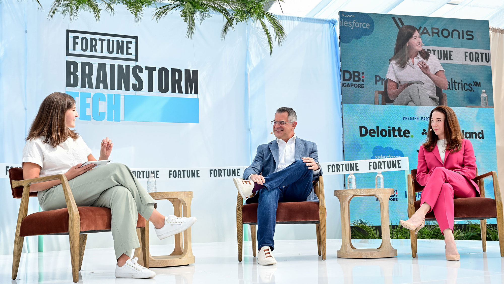 A group of people sitting in chairs.
