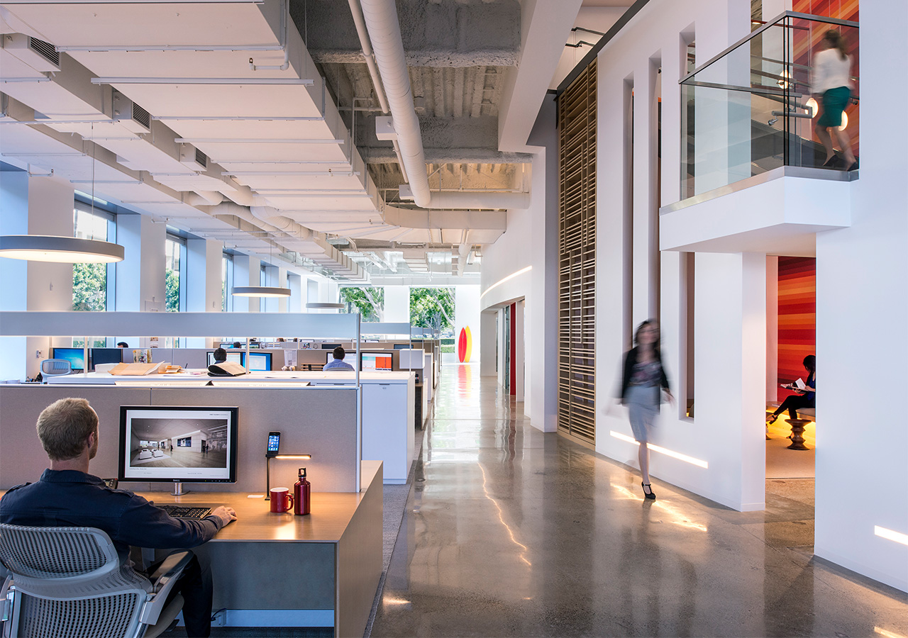 A person walking in an office.