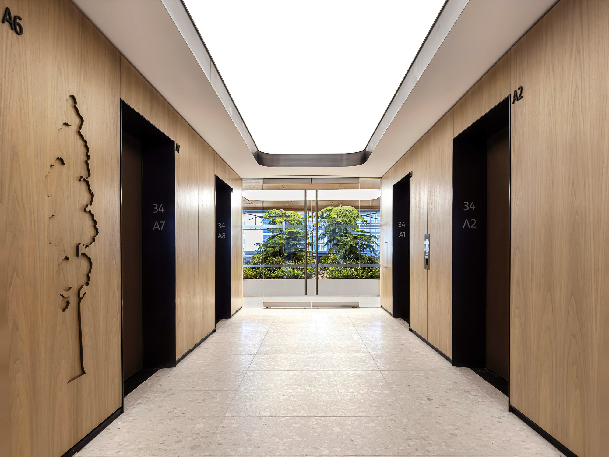A hallway with wood doors.