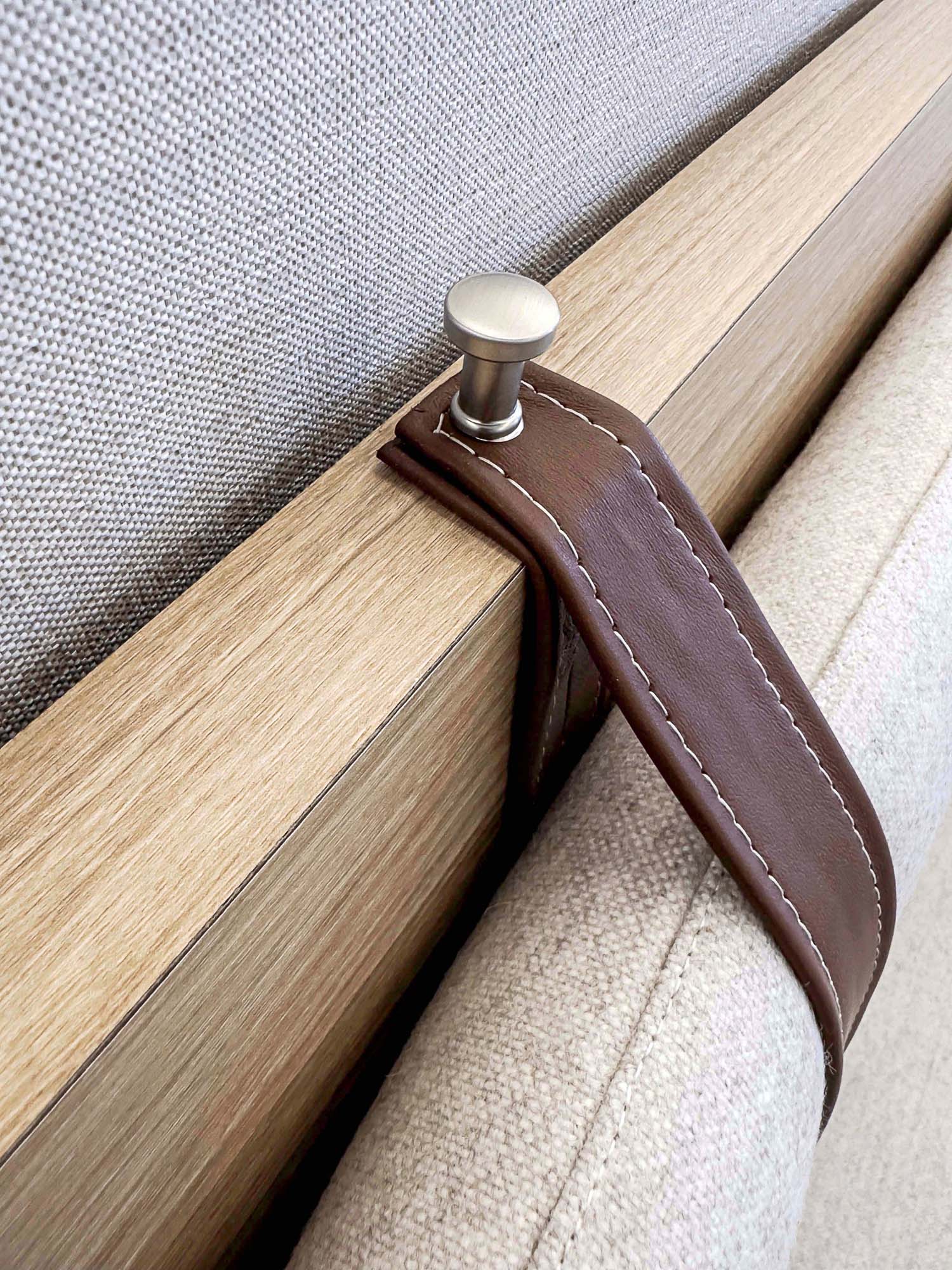 A wood object with a metal tube.