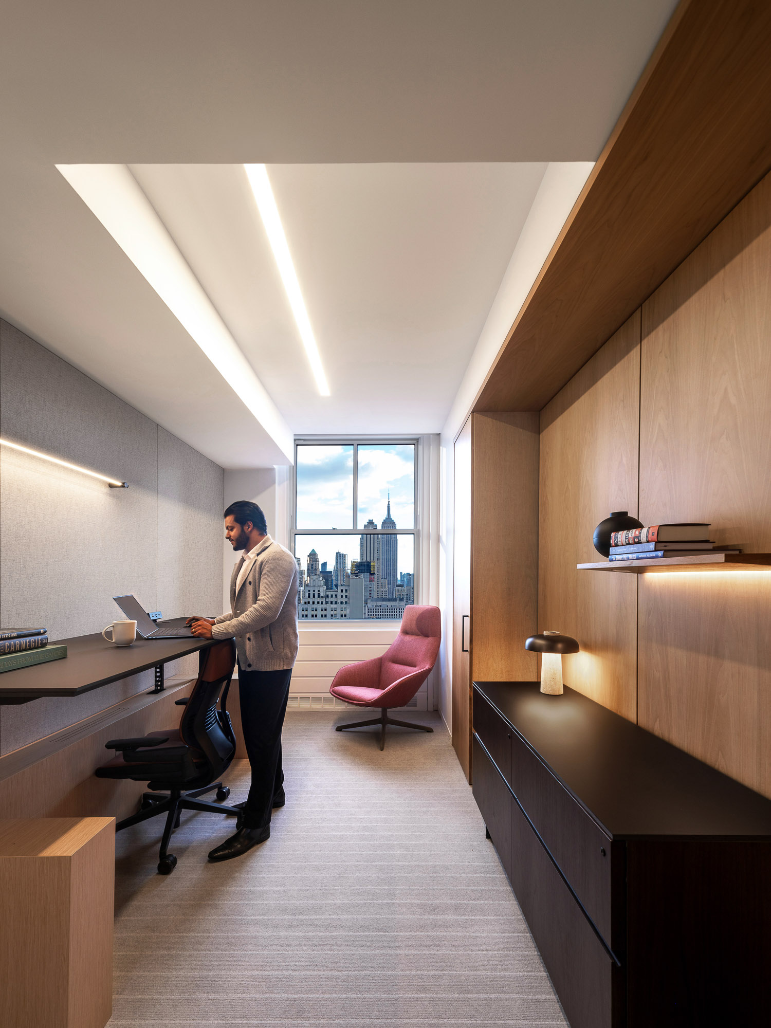 A man standing in an office.