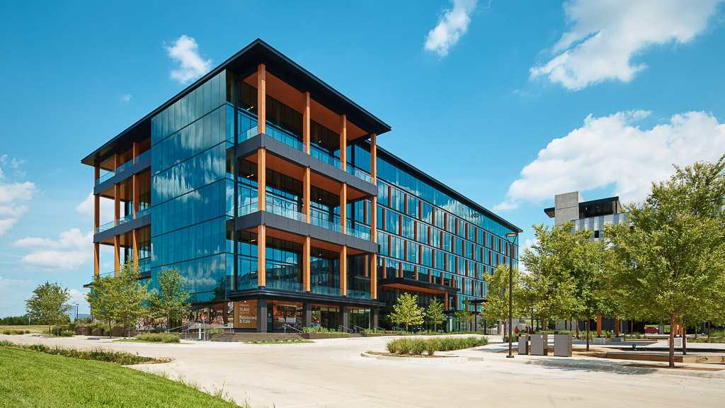 A building with trees and grass.