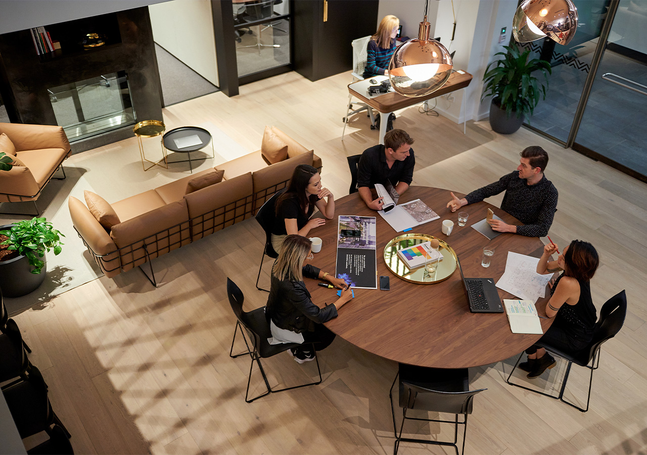 A group of people sitting around a table.