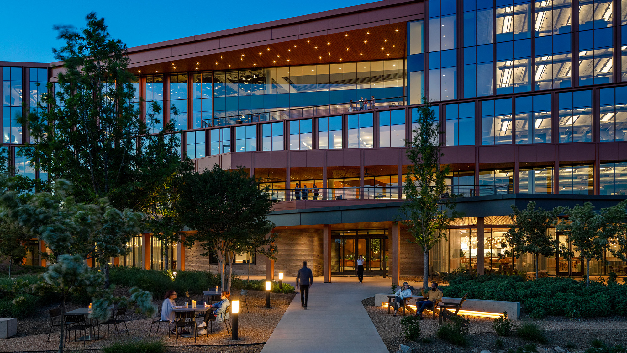 A building with trees and people outside.