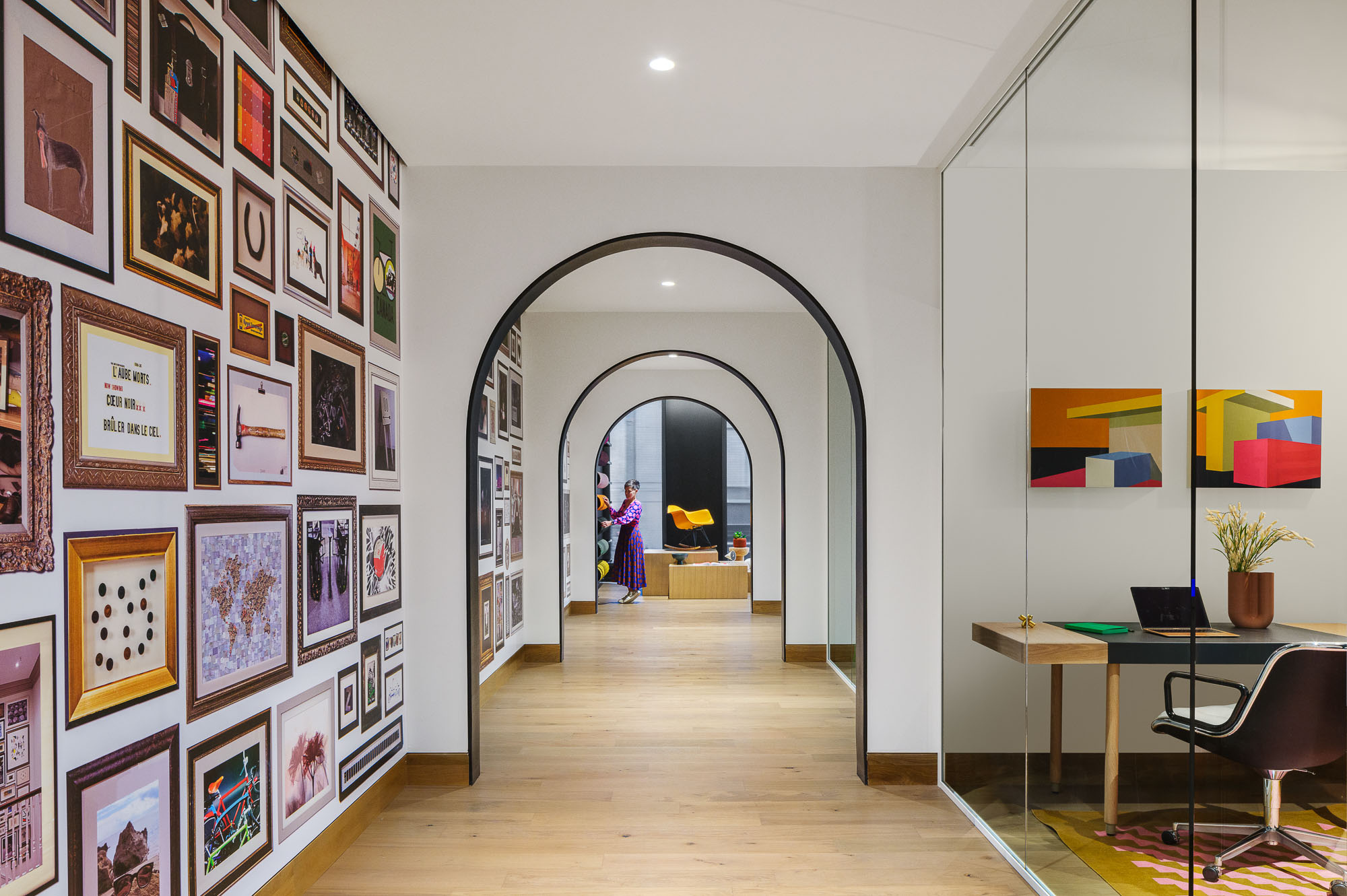 A hallway with a table and chairs.